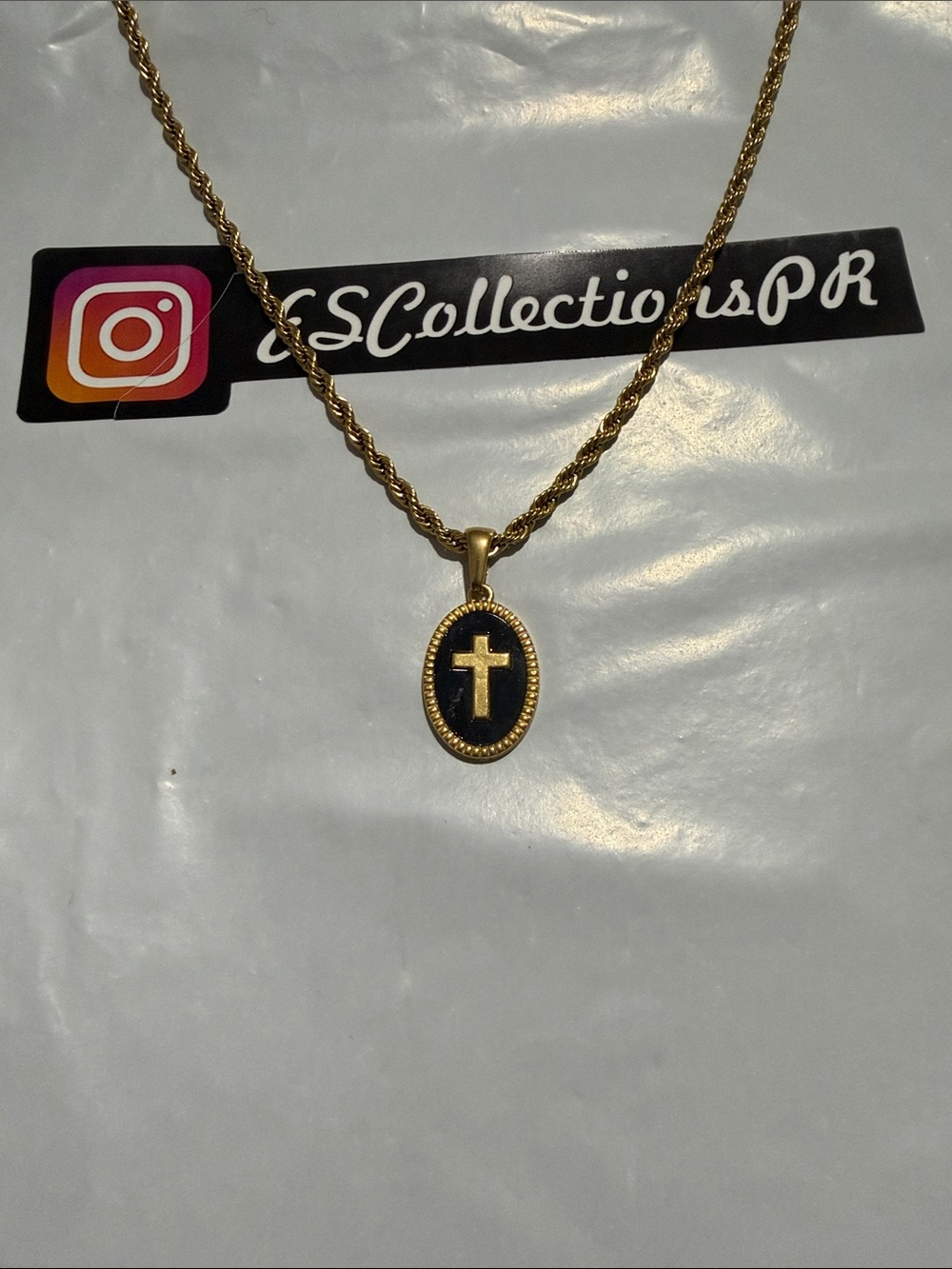 Gold-Tone Oval Cross Pendant Necklace with Black Enamel